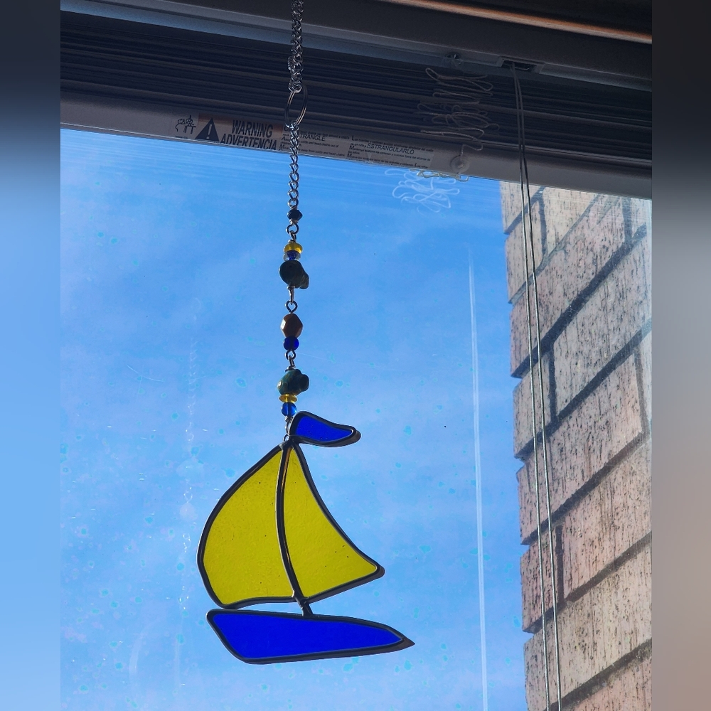 Stained glass sailboat window hang